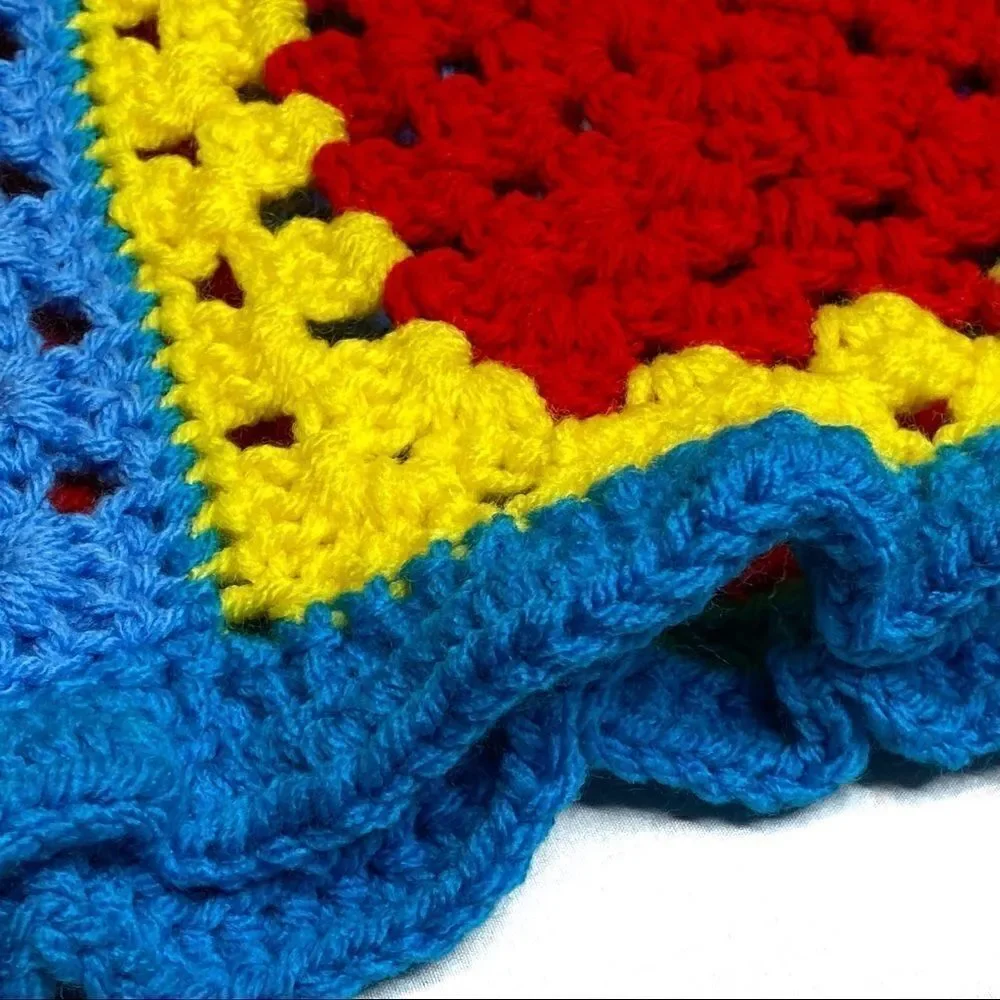 Hand crocheted bright multi colored Afghan size 56” X 31”